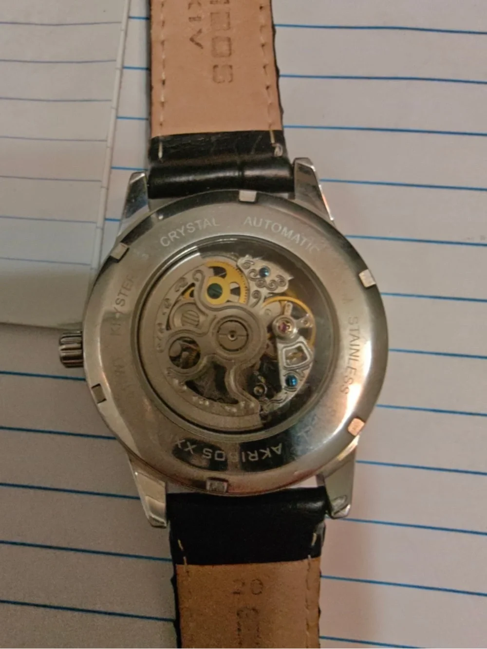 Akribos XXIV Black Leather Strap Skeleton Dial Watch with Blue Hands
